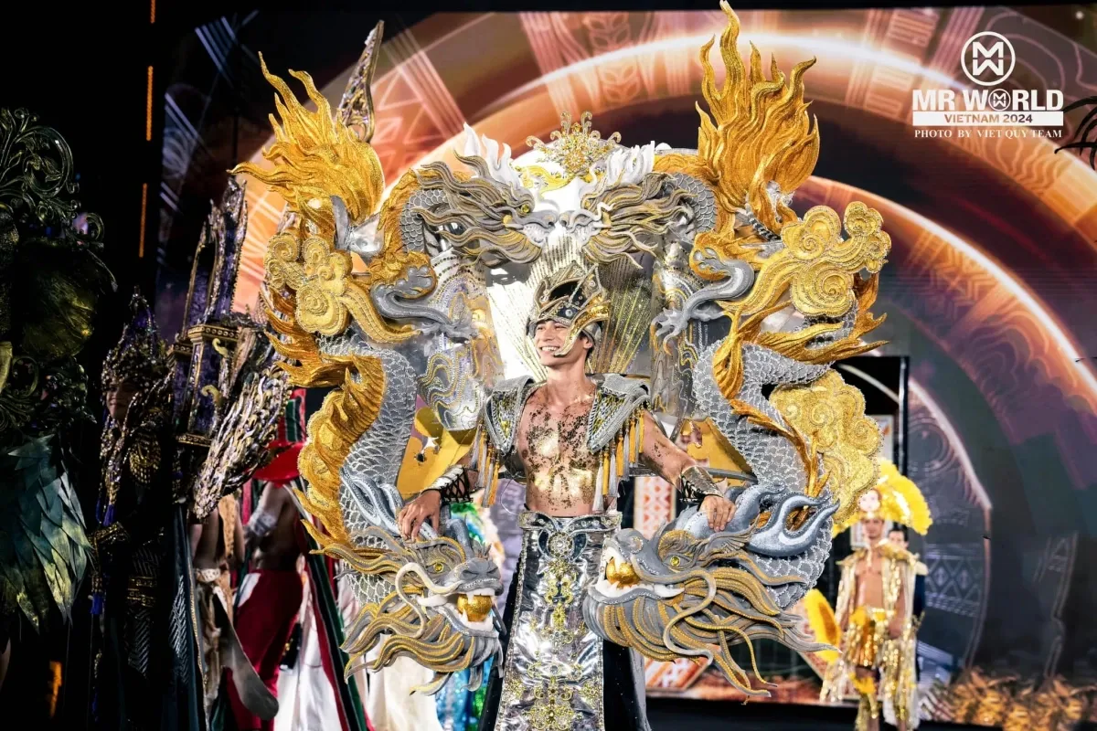 Mister World contestant in national costume during cultural presentation"